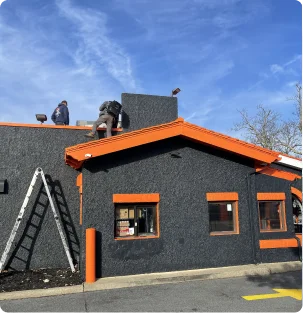 Technicians working on restaurant rooftop